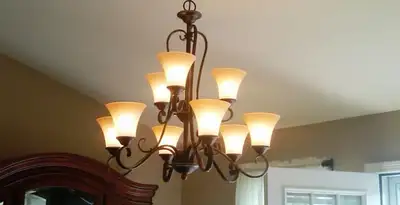 Classic ceiling chandelier installation with warm lighting in Allentown, PA