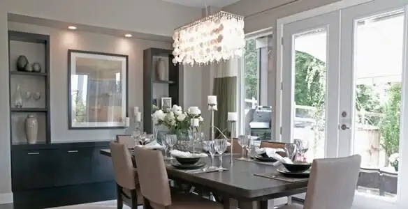 Elegant dining room chandelier installation above table in Allentown, PA