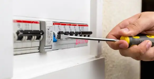 electrical panel upgrade service showing technician adjusting circuit breakers during system upgrade in Allentown, PA