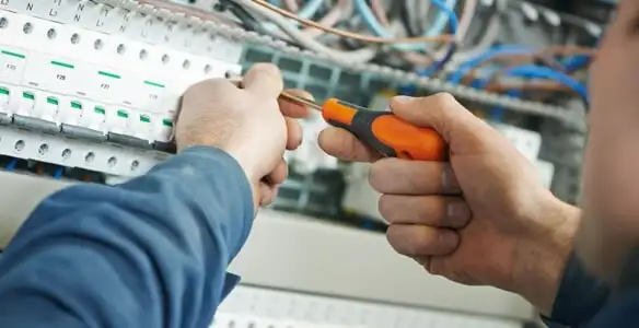 electrical service showing licensed electrician performing electrical panel maintenance and adjustments in Allentown, PA