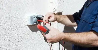 Electrician performing home electrical outlet and wiring inspection in Allentown, PA