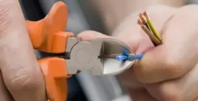 professional electrical services showing precise wire cutting by licensed electricians in Allentown, PA