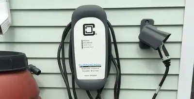 Outdoor electric vehicle charger installation on residential wall in Allentown, PA