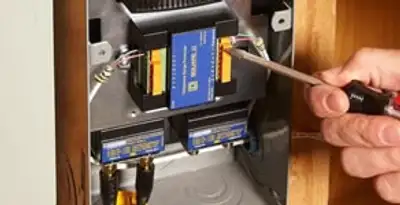 Whole home surge protection device being installed by a licensed electrician to protect electrical systems in Allentown, PA